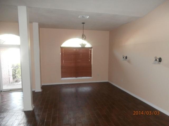 43 Beacon Way Santa Rosa Beach, FL 32459 - Photo 5 of 19 a view of an empty room with wooden floor and a window