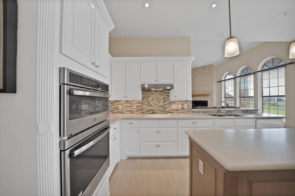 11692 Foutch Road Pilot Point, TX 76258 - Photo 15 of 40 a kitchen with stainless steel appliances granite countertop a stove a sink and a refrigerator