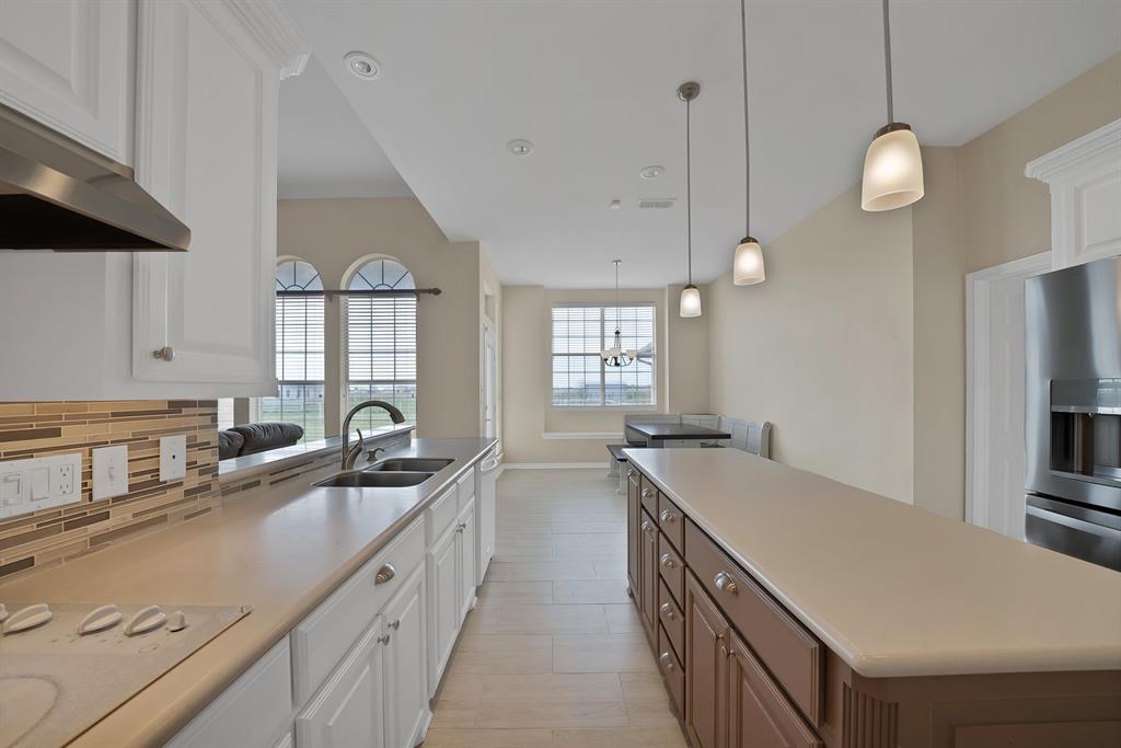 11692 Foutch Road Pilot Point, TX 76258 - Photo 17 of 40 a kitchen with a sink stove and cabinets