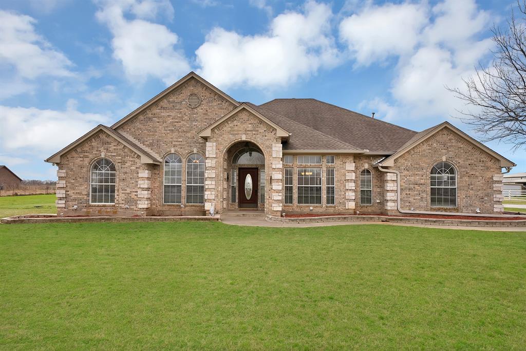 11692 Foutch Road Pilot Point, TX 76258 - Photo 2 of 40 a front view of a house with a garden and yard