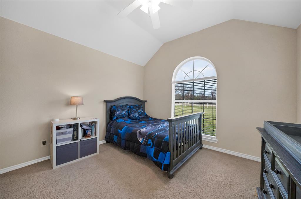 11692 Foutch Road Pilot Point, TX 76258 - Photo 22 of 40 a bed room with a bed and a window