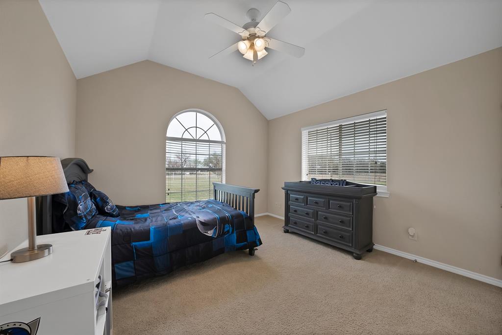 11692 Foutch Road Pilot Point, TX 76258 - Photo 23 of 40 a bed room with a bed and a window