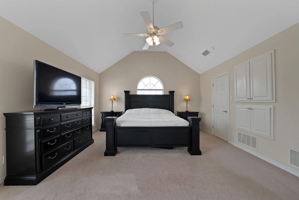 11692 Foutch Road Pilot Point, TX 76258 - Photo 27 of 40 a bedroom with a bed and a flat screen tv