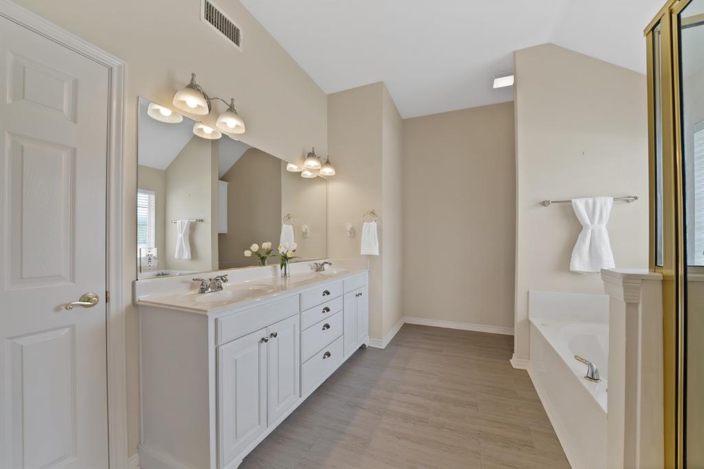 11692 Foutch Road Pilot Point, TX 76258 - Photo 29 of 40 a bathroom with a double vanity sink and a mirror