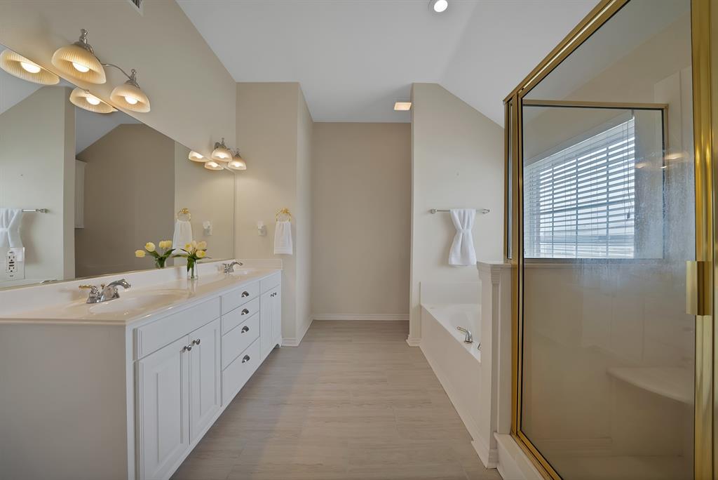 11692 Foutch Road Pilot Point, TX 76258 - Photo 30 of 40 a bathroom with a double vanity sink and mirror