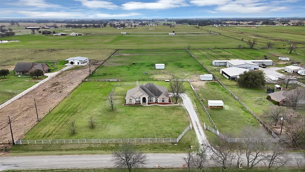 11692 Foutch Road Pilot Point, TX 76258 - Photo 3 of 40 a view of a lake with a building in the background