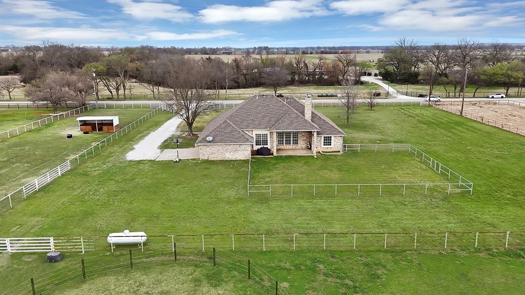 11692 Foutch Road Pilot Point, TX 76258 - Photo 40 of 40 a view of a swimming pool with a yard and plants