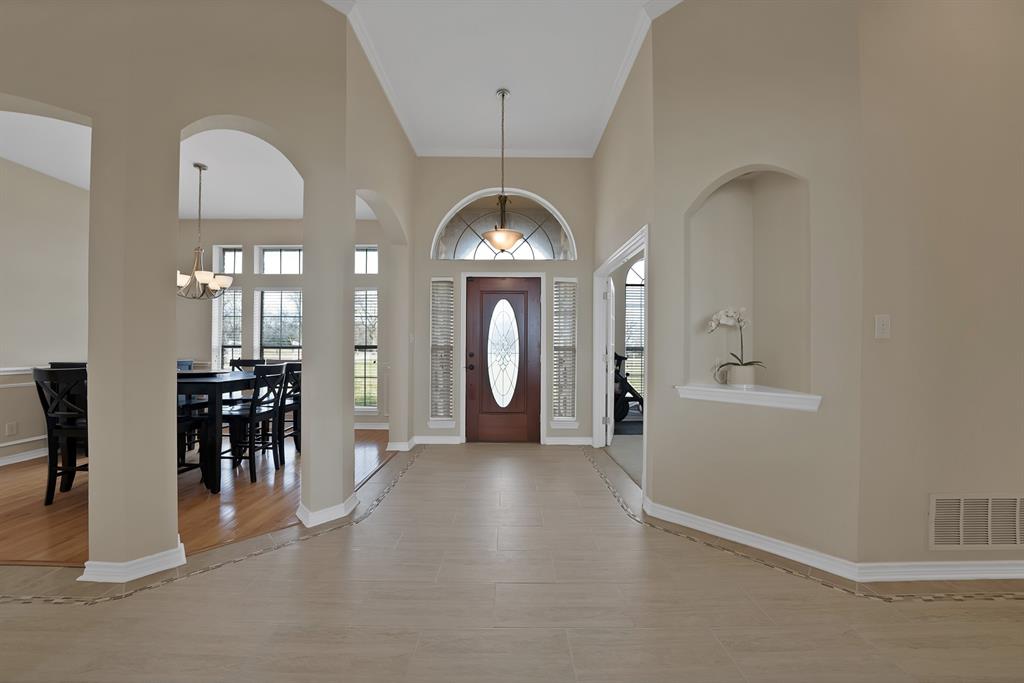 11692 Foutch Road Pilot Point, TX 76258 - Photo 5 of 40 a view of a livingroom with furniture and a chandelier