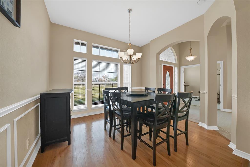 11692 Foutch Road Pilot Point, TX 76258 - Photo 7 of 40 a view of a dining room with furniture window and wooden floor
