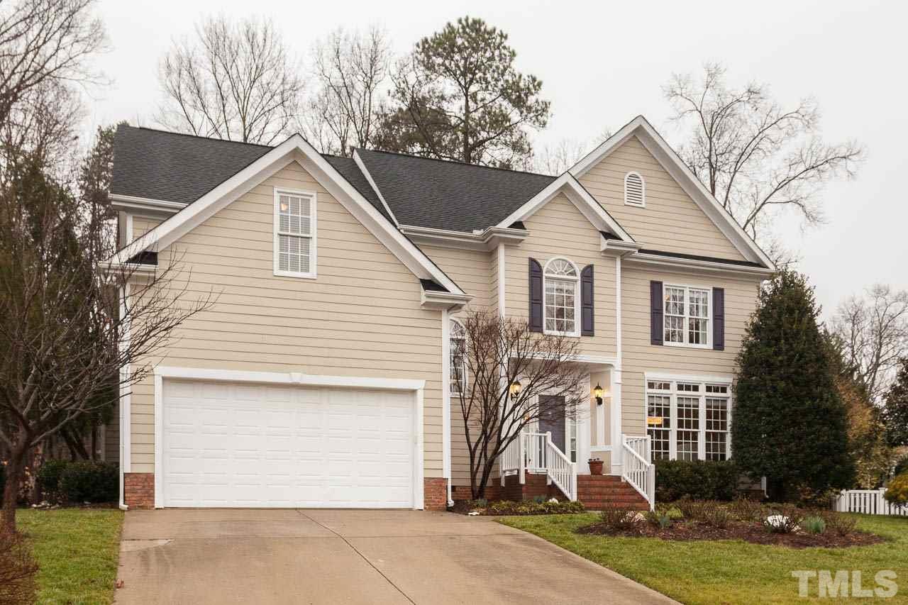 5404 Killarney Hope Drive Raleigh, NC 27613 - Photo 1 of 22 a front view of a house with a yard and garage