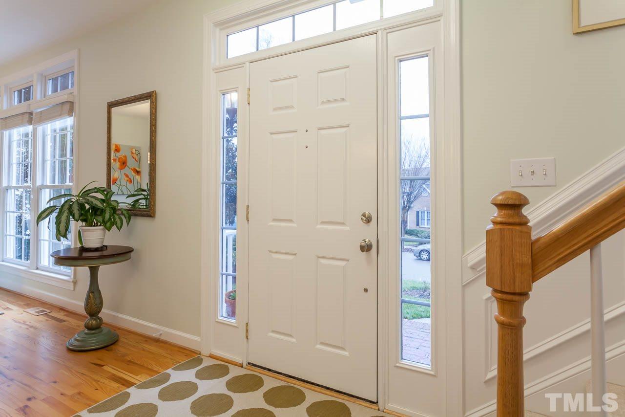 5404 Killarney Hope Drive Raleigh, NC 27613 - Photo 2 of 22 a view of hallway with paintings on the wall
