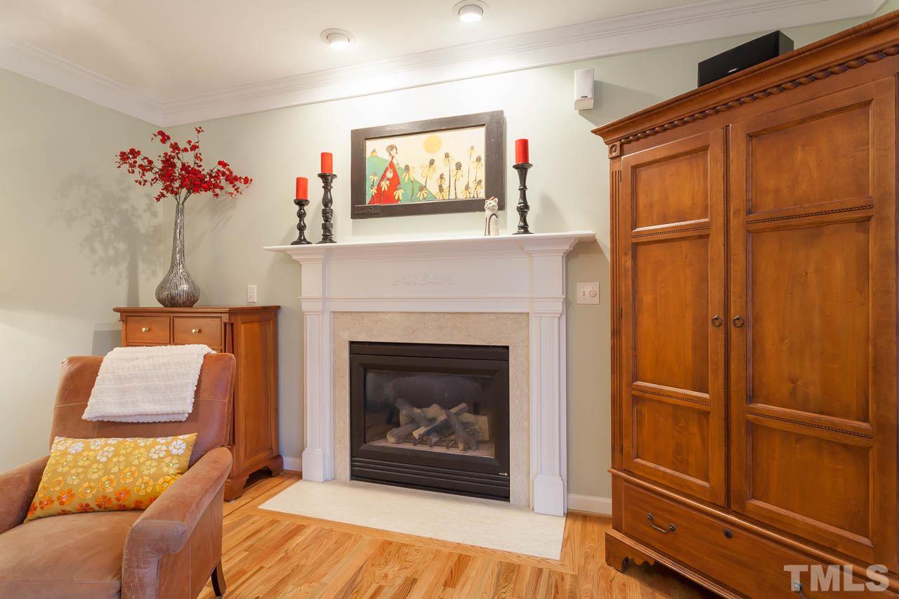5404 Killarney Hope Drive Raleigh, NC 27613 - Photo 10 of 22 a living room with furniture and a fireplace