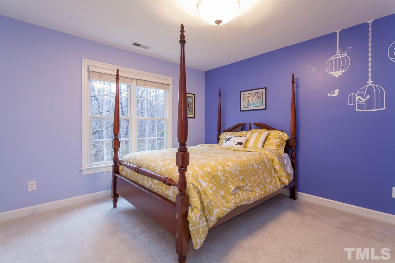 5404 Killarney Hope Drive Raleigh, NC 27613 - Photo 15 of 22 a bed sitting in a bedroom next to a window