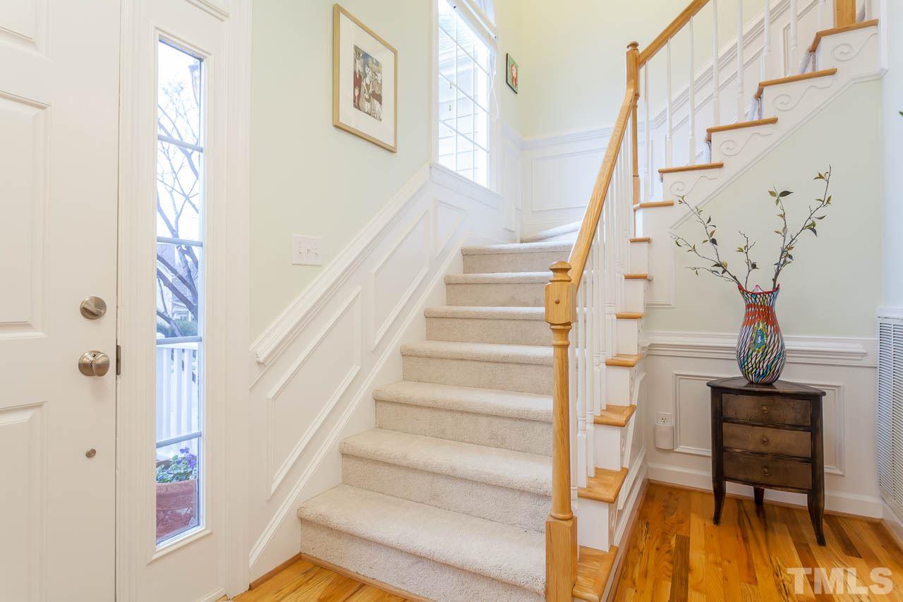 5404 Killarney Hope Drive Raleigh, NC 27613 - Photo 3 of 22 a view of entryway with wooden floor and a front door