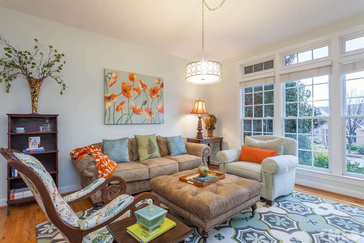 5404 Killarney Hope Drive Raleigh, NC 27613 - Photo 5 of 22 a living room with furniture a table and a chandelier