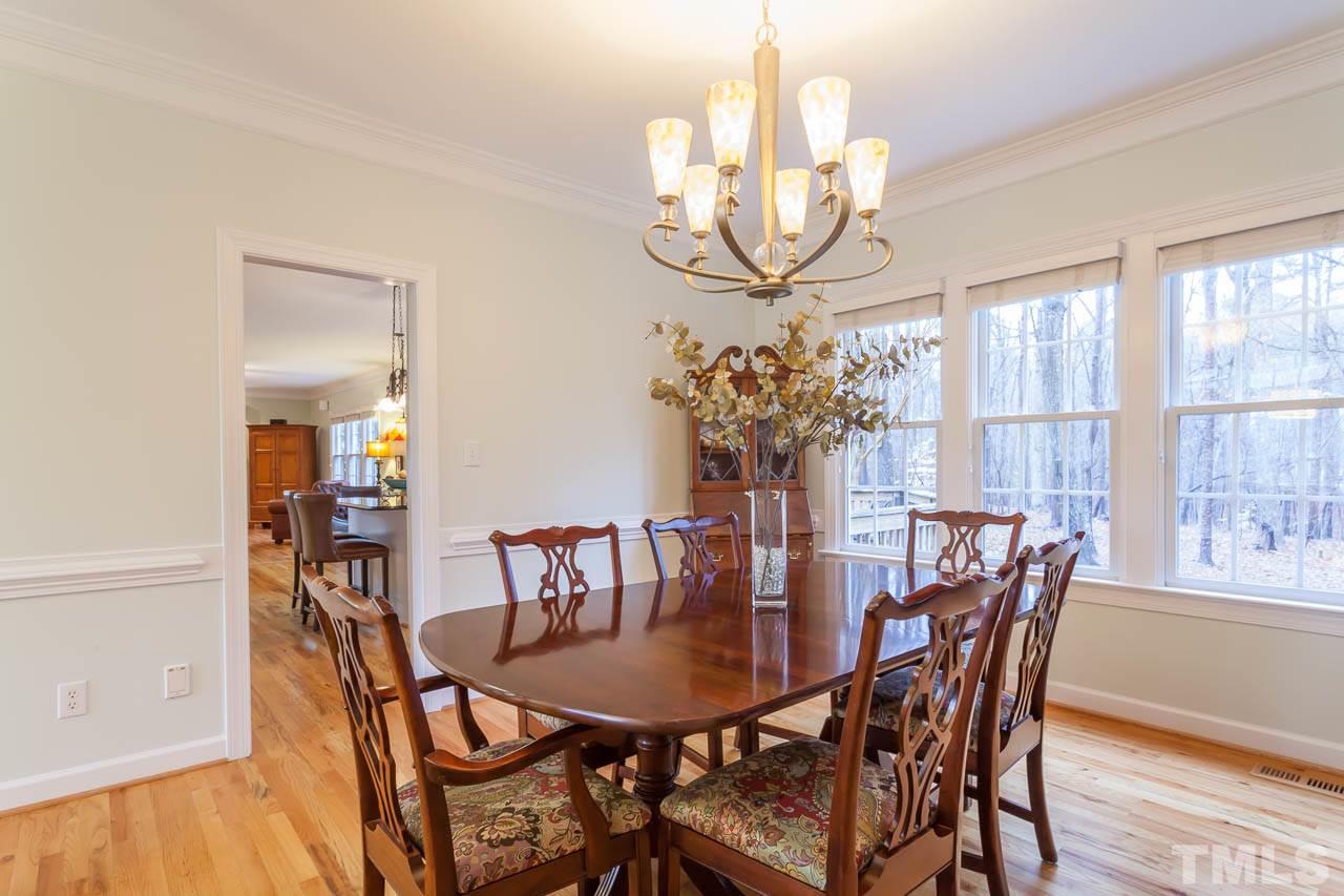 5404 Killarney Hope Drive Raleigh, NC 27613 - Photo 6 of 22 a view of a dining room with furniture wooden floor and chandelier