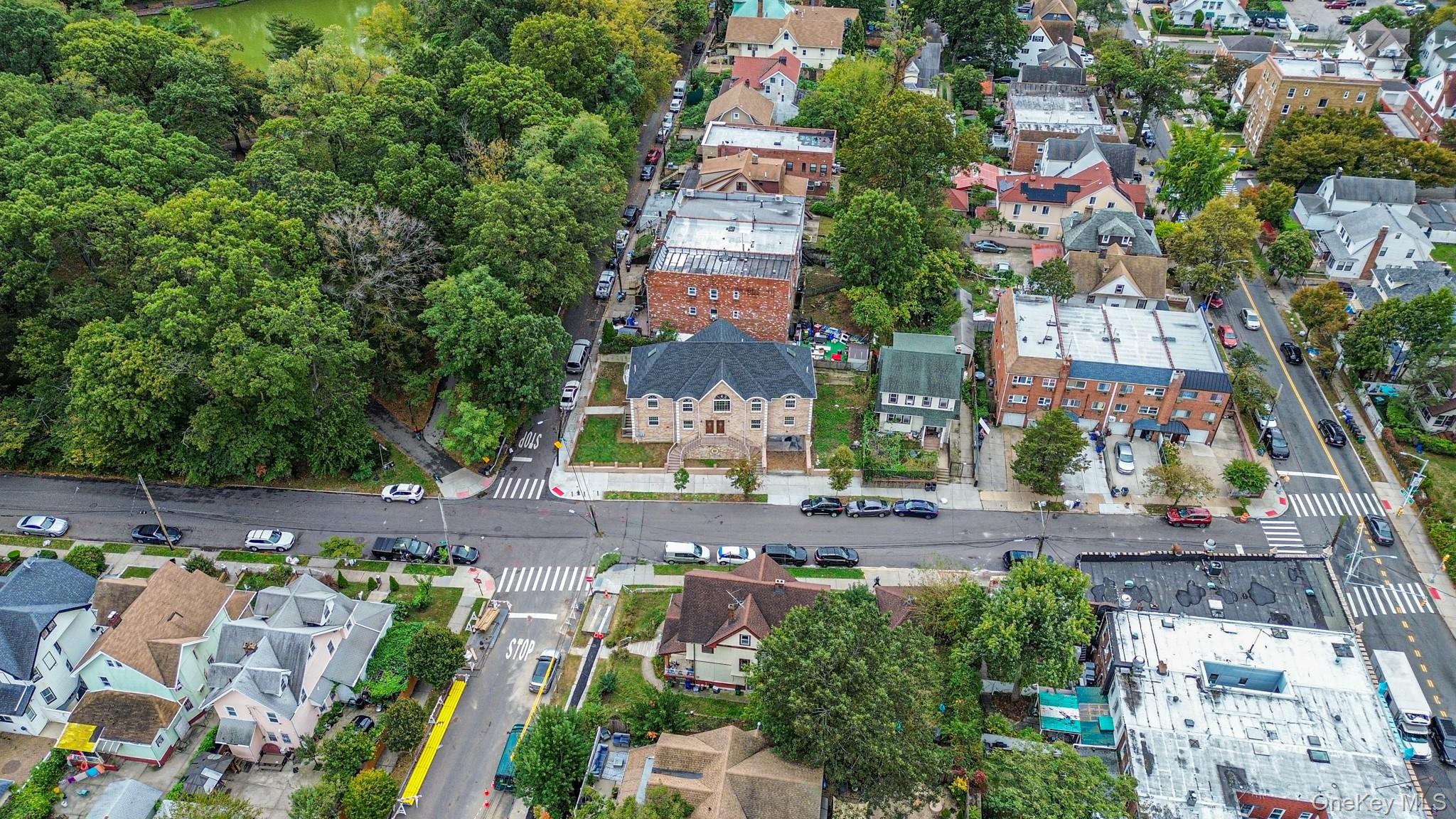 85-02 165th Street Queens, NY 11432 - Photo 5 of 36 Aerial view of property and surrounding area with nearby suburban area