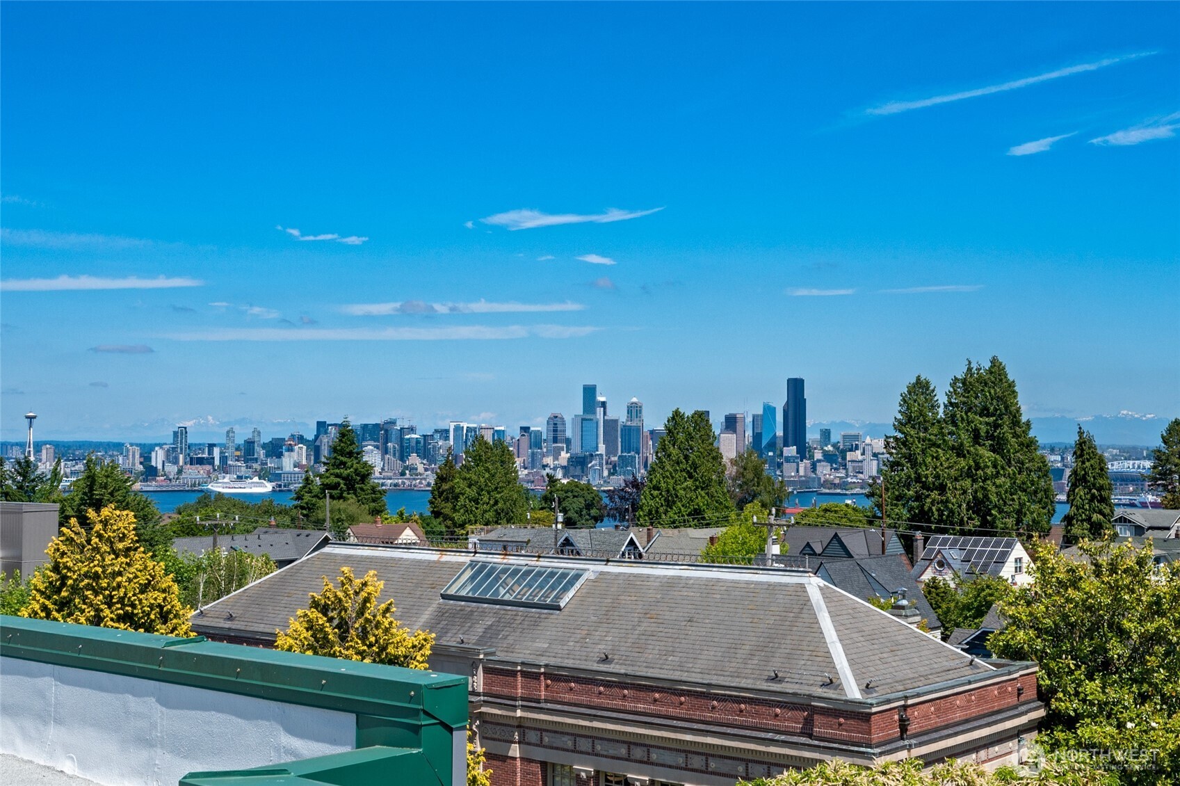 2331 42nd Avenue Southwest, Unit 209 Seattle, WA 98116 - Photo 17 of 21 a view of a city from a terrace