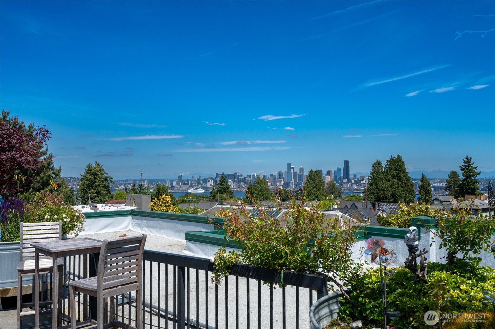 2331 42nd Avenue Southwest, Unit 209 Seattle, WA 98116 - Photo 19 of 21 a view of a city with lawn chairs