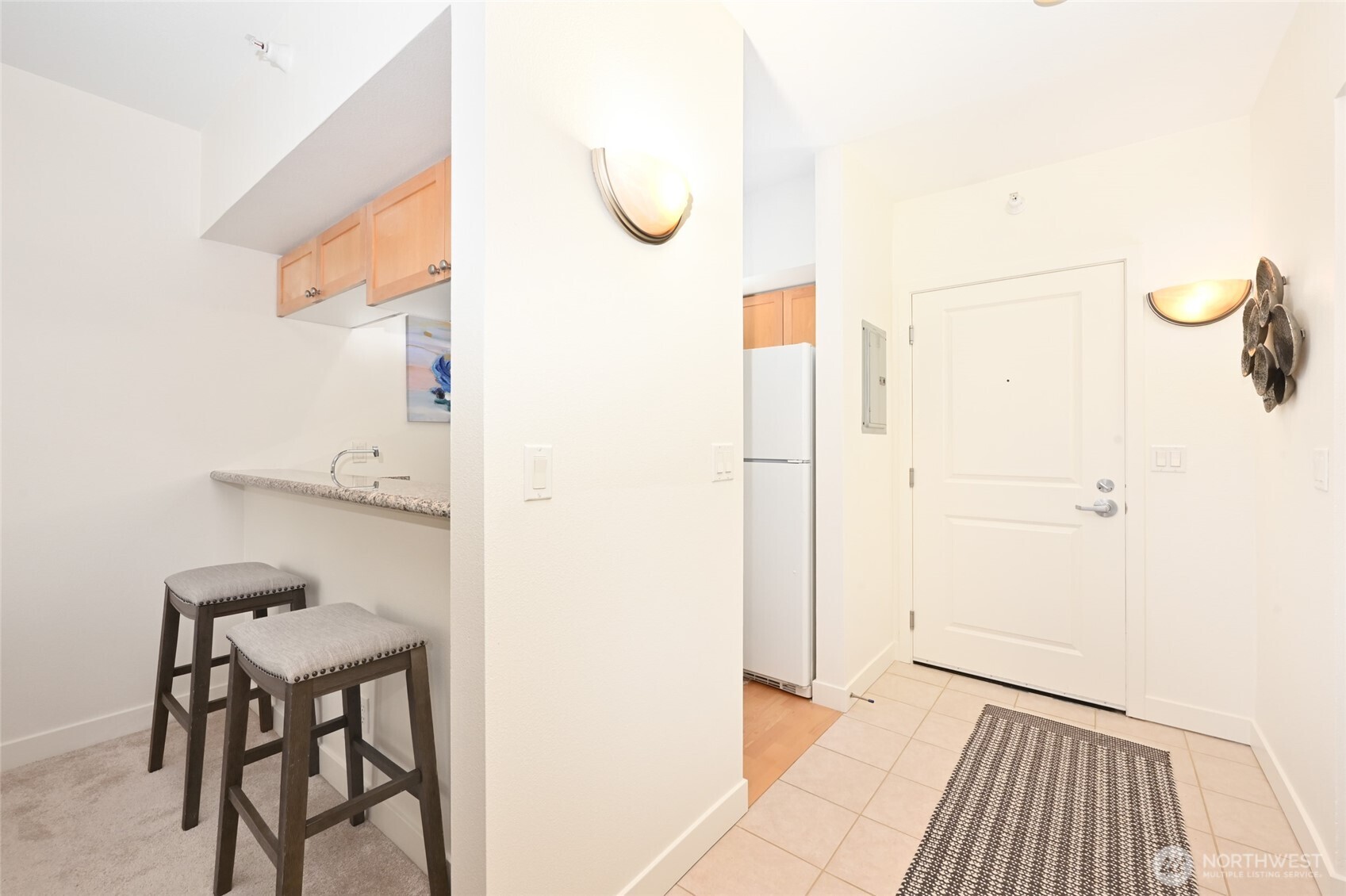 2331 42nd Avenue Southwest, Unit 209 Seattle, WA 98116 - Photo 6 of 21 a bathroom with a sink and a mirror