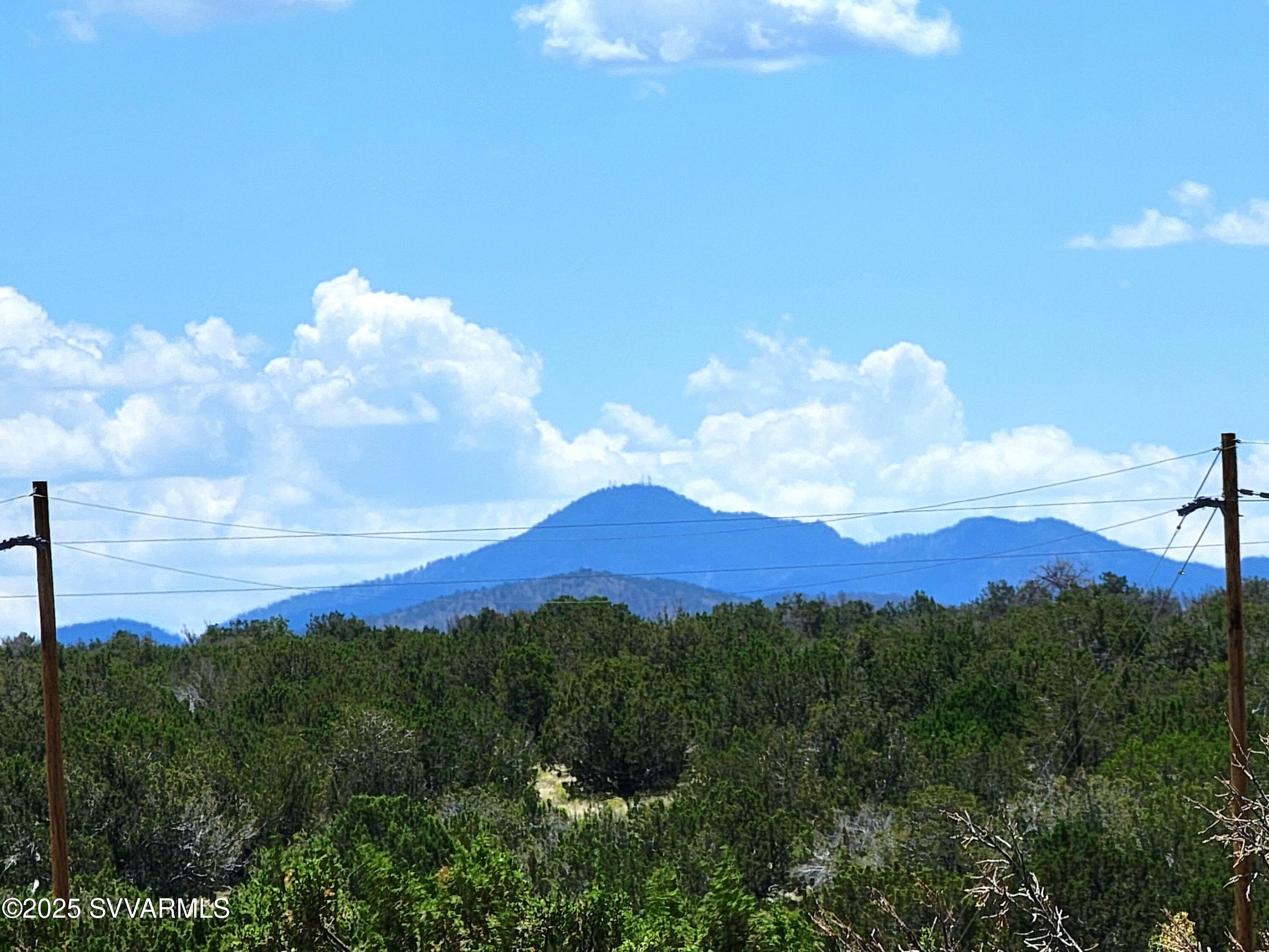 2179 West Critter Pass Road Williams, AZ 86046 - Photo 5 of 34 a view of a city with lush green forest