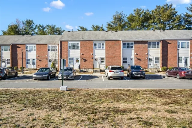 a view of a car parked in front of a house