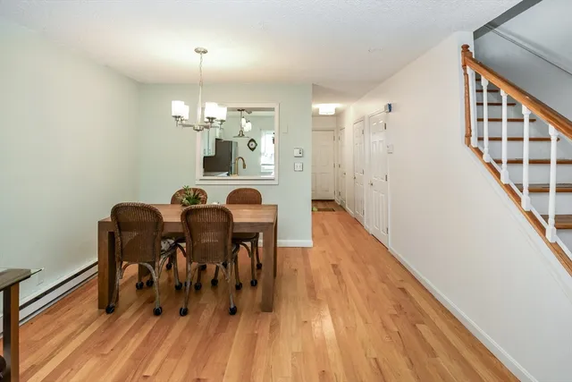 a dining room with furniture and wooden floor