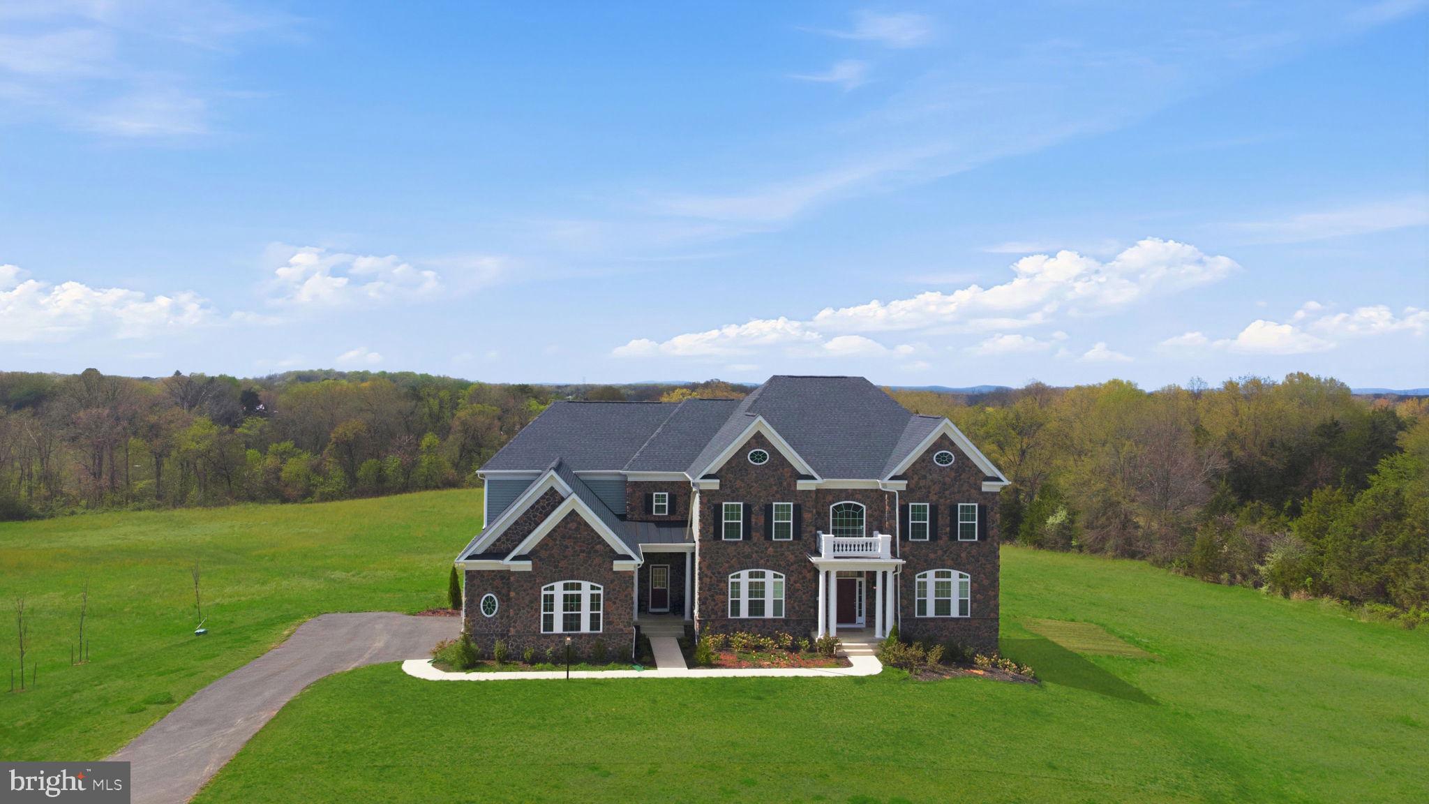 11502 Aden Road Nokesville, VA 20181 - Photo 3 of 106 a view of a house with big yard and large trees
