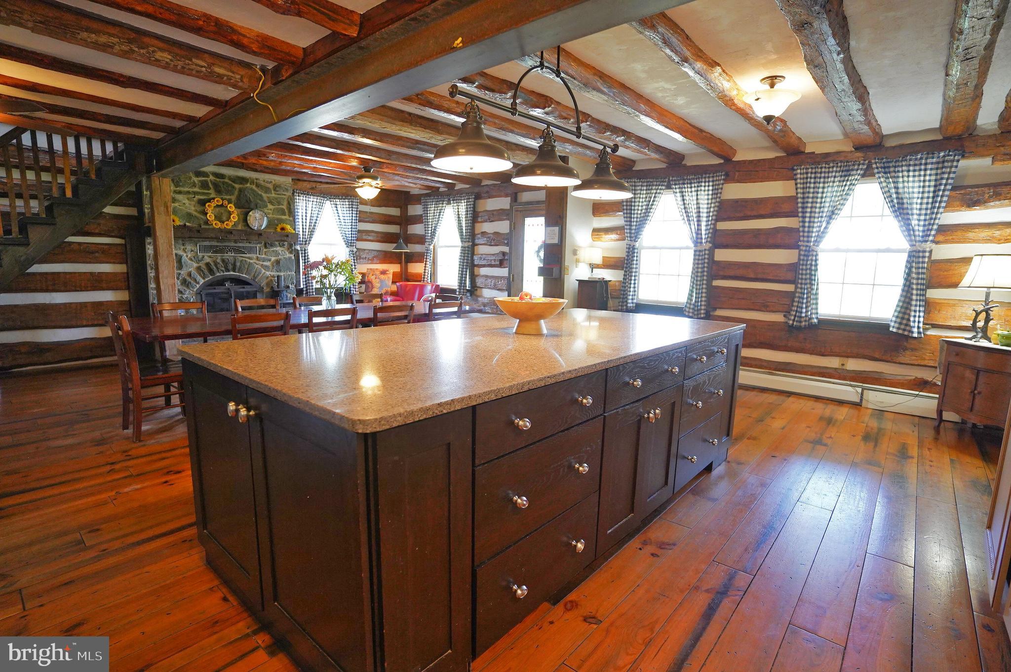 2215 Centennial Road Hanover, PA 17331 - Photo 15 of 60 a living room with stainless steel appliances granite countertop a sink and wooden floors