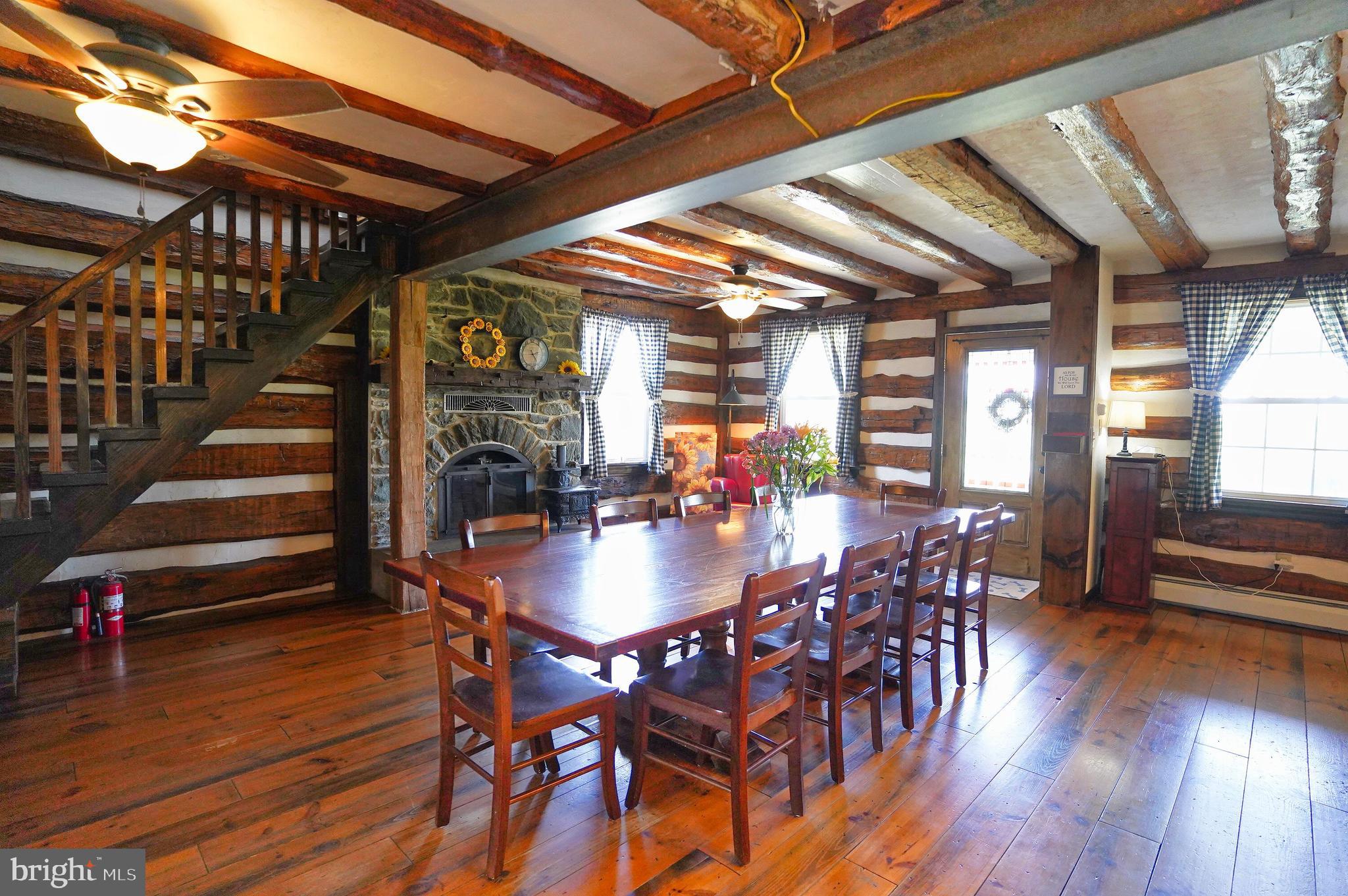 2215 Centennial Road Hanover, PA 17331 - Photo 19 of 60 a dining room with furniture wooden floor and a chandelier