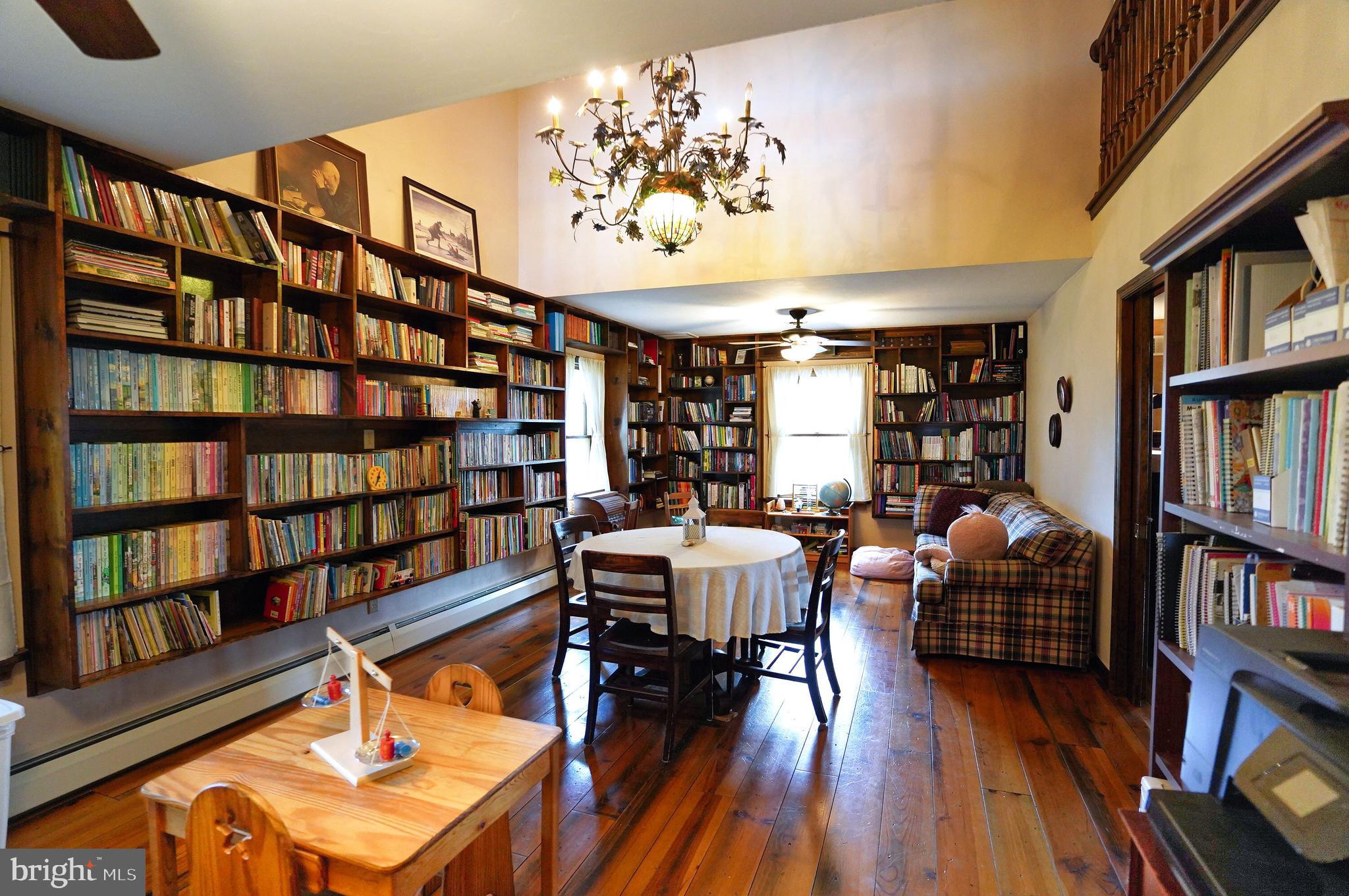 2215 Centennial Road Hanover, PA 17331 - Photo 22 of 60 a reading room with furniture book shelf and wooden floor