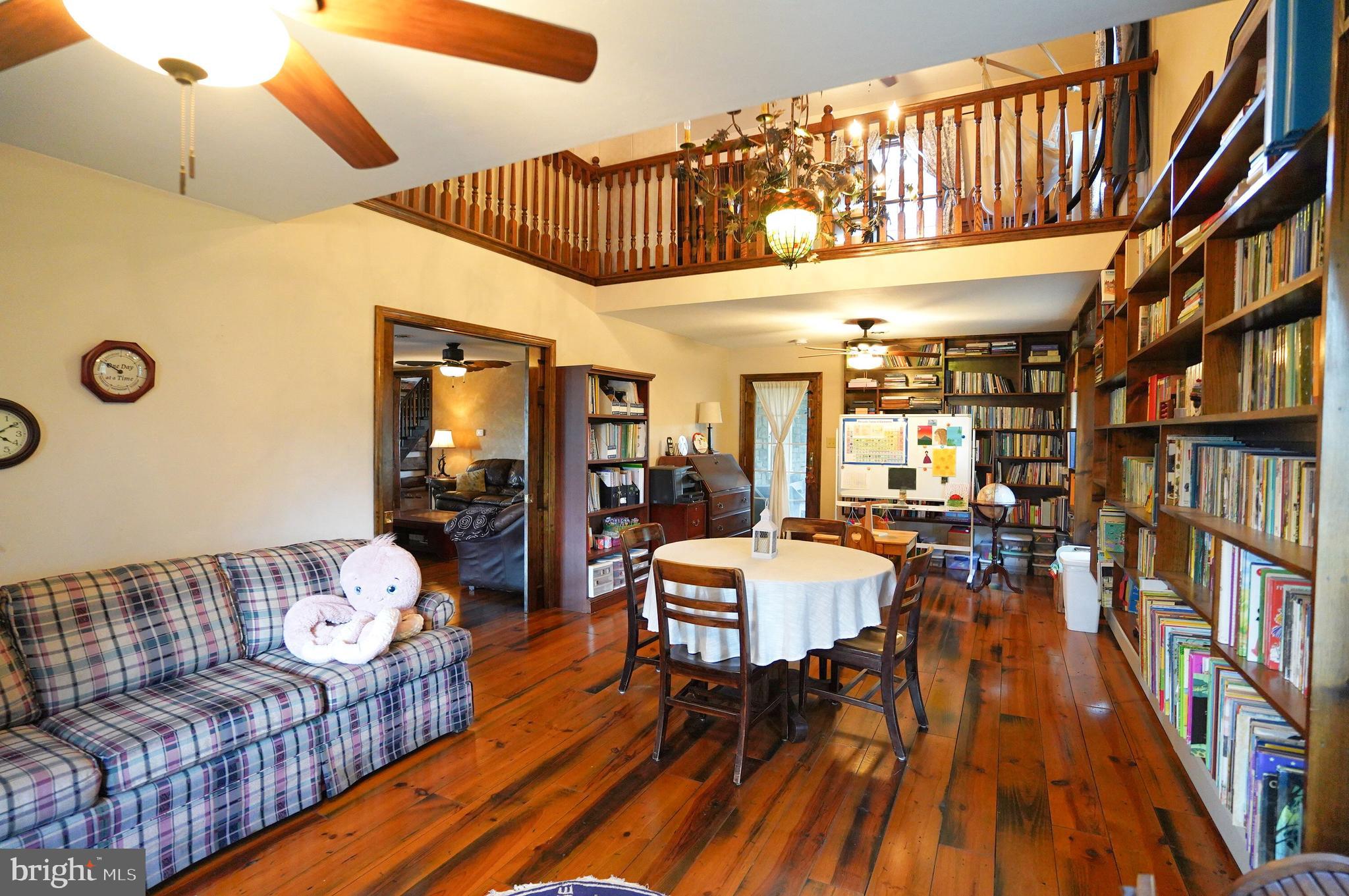 2215 Centennial Road Hanover, PA 17331 - Photo 23 of 60 a living room with furniture and a book shelf