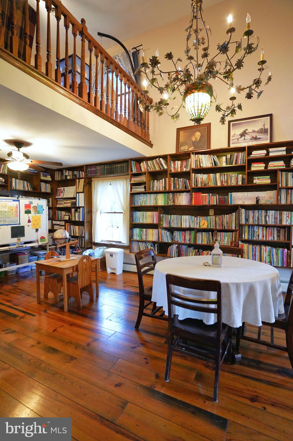 2215 Centennial Road Hanover, PA 17331 - Photo 24 of 60 a view of a big room with furniture window and wooden floor