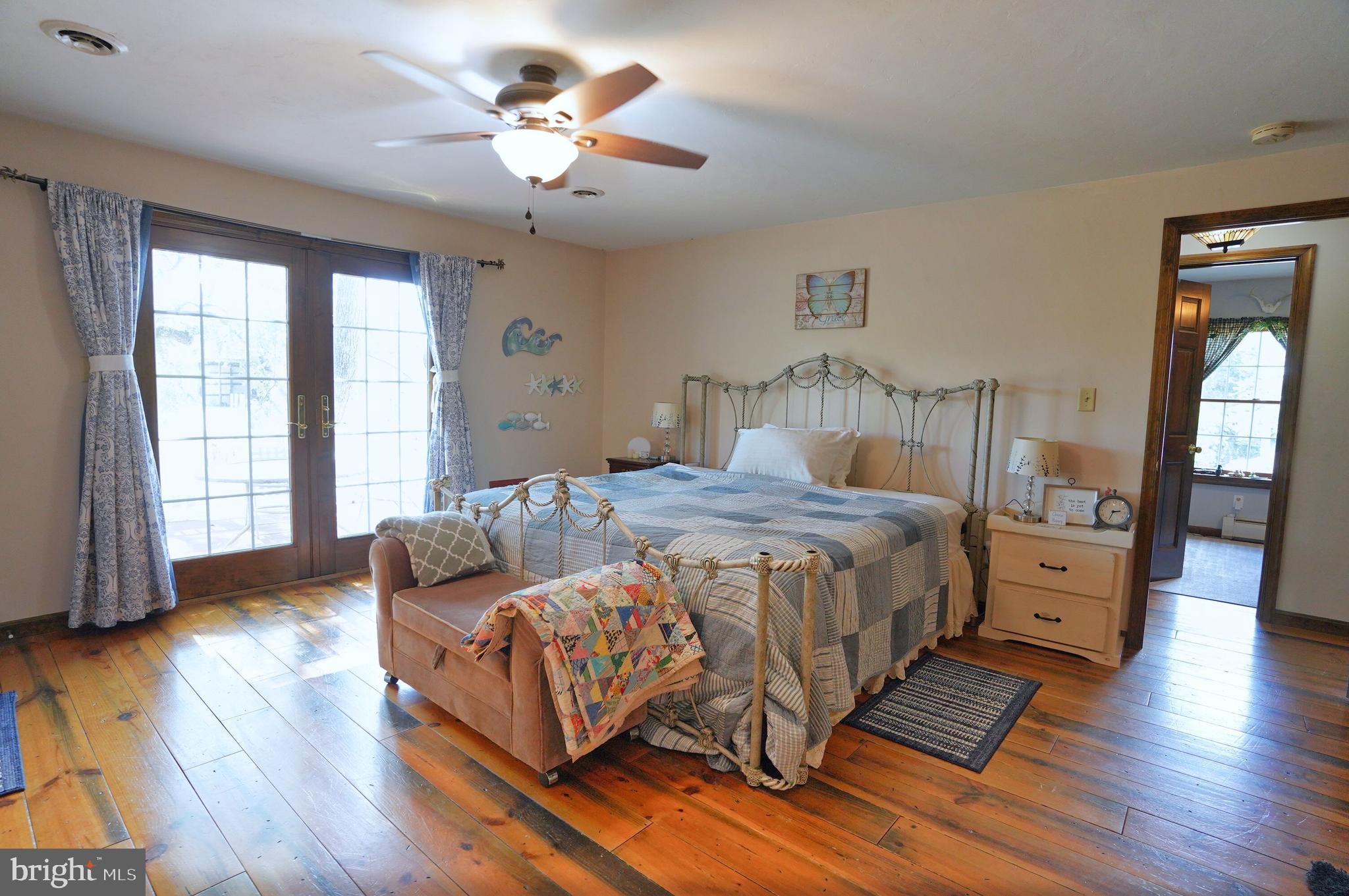 2215 Centennial Road Hanover, PA 17331 - Photo 28 of 60 a bedroom with a bed and wooden floor