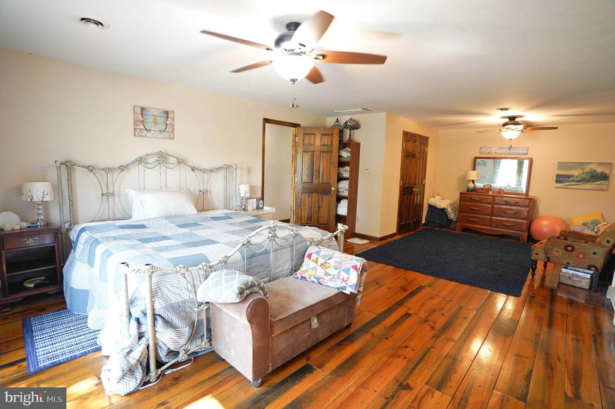 2215 Centennial Road Hanover, PA 17331 - Photo 29 of 60 a bedroom with a bed and wooden floor