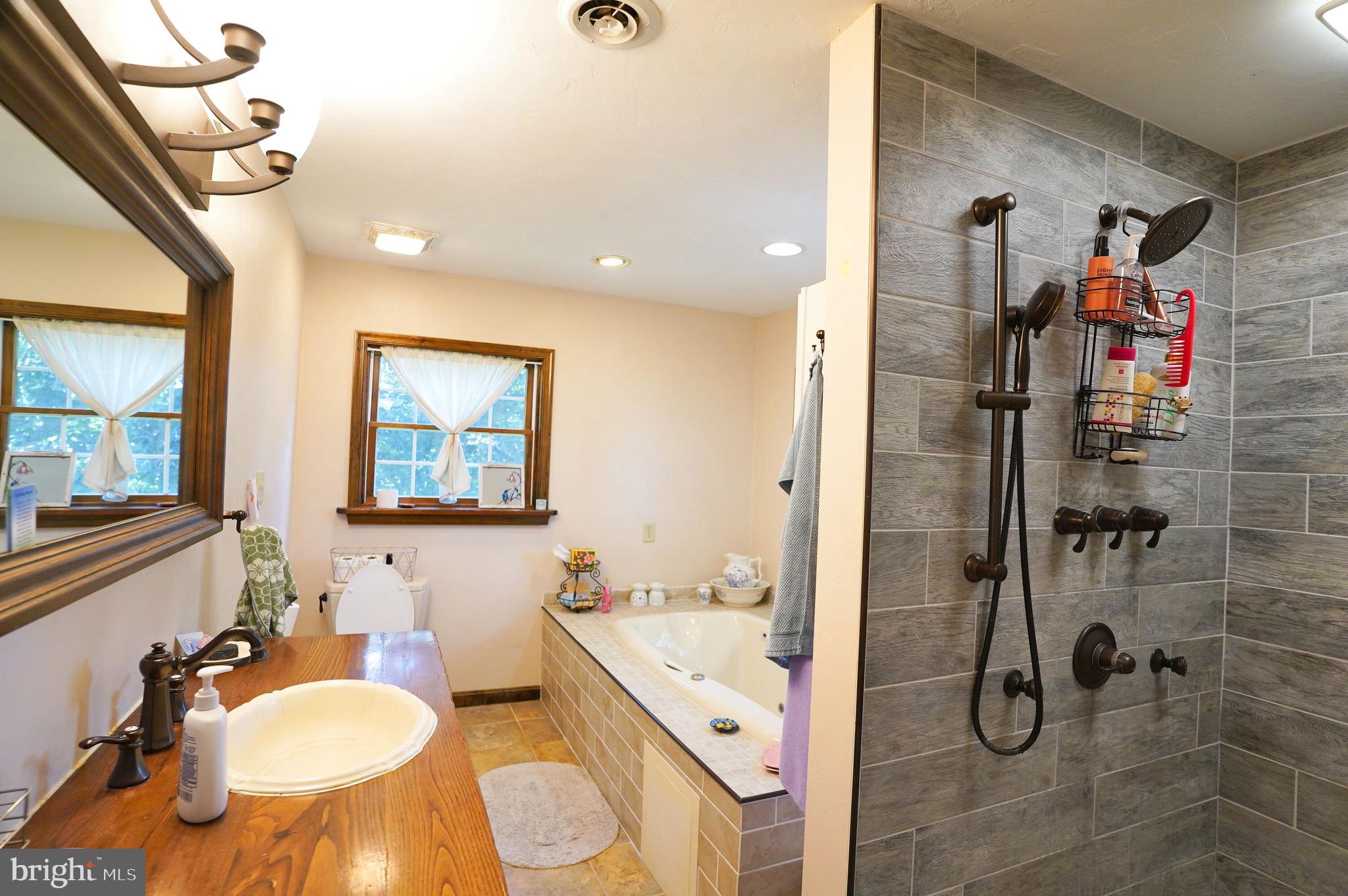 2215 Centennial Road Hanover, PA 17331 - Photo 32 of 60 a bathroom with a granite countertop sink mirror vanity and toilet