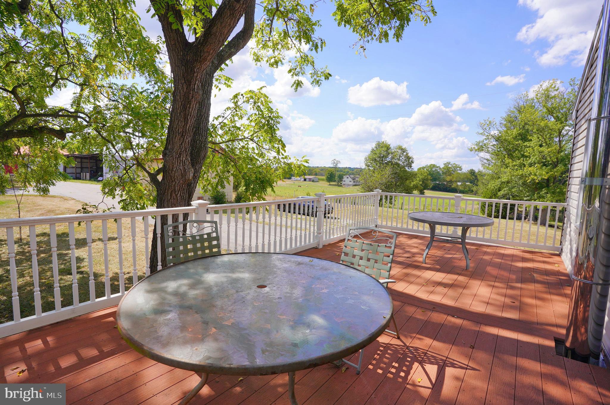 2215 Centennial Road Hanover, PA 17331 - Photo 38 of 60 a view of a chairs and tables on the deck