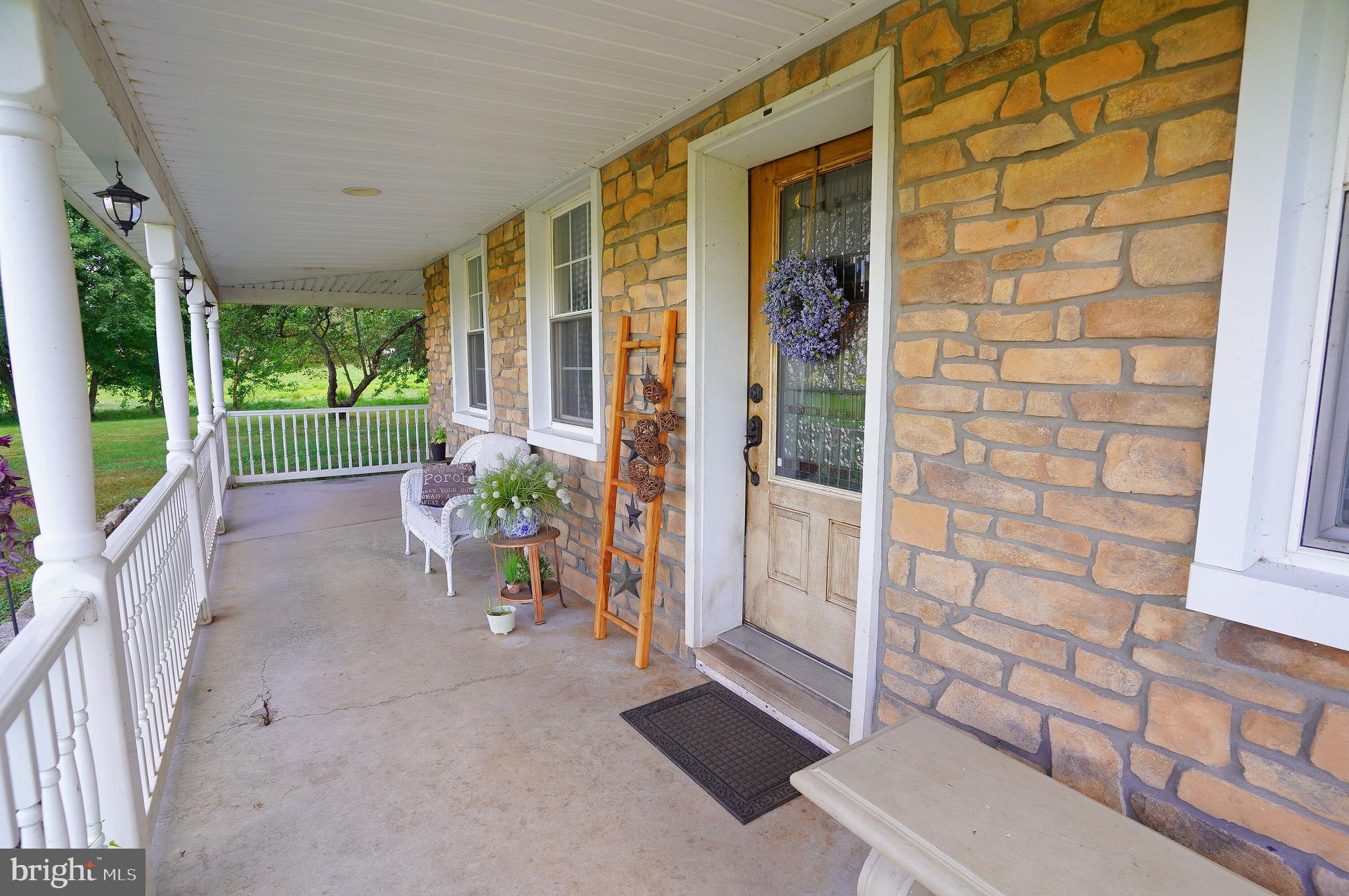 2215 Centennial Road Hanover, PA 17331 - Photo 4 of 60 a view of a porch with wooden floor and outdoor space