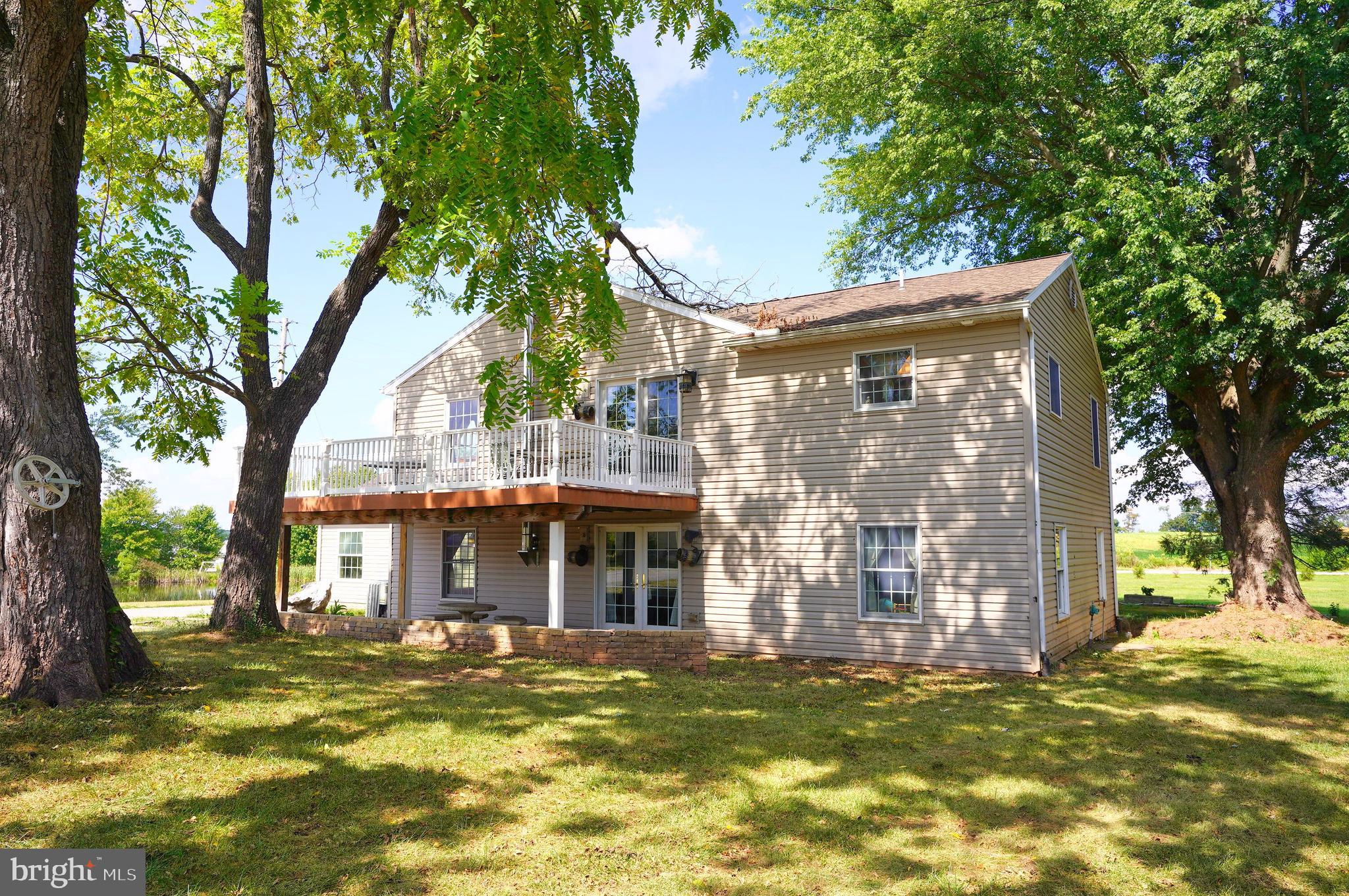 2215 Centennial Road Hanover, PA 17331 - Photo 50 of 60 a view of a house with a large tree and a yard