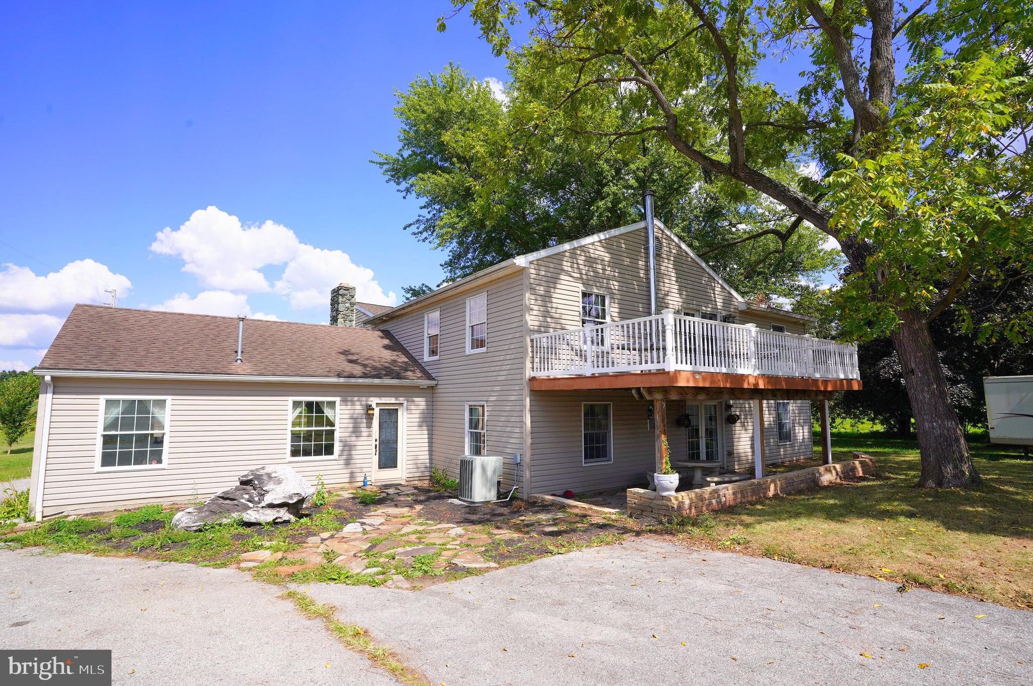 2215 Centennial Road Hanover, PA 17331 - Photo 51 of 60 a front view of a house with a yard and garage