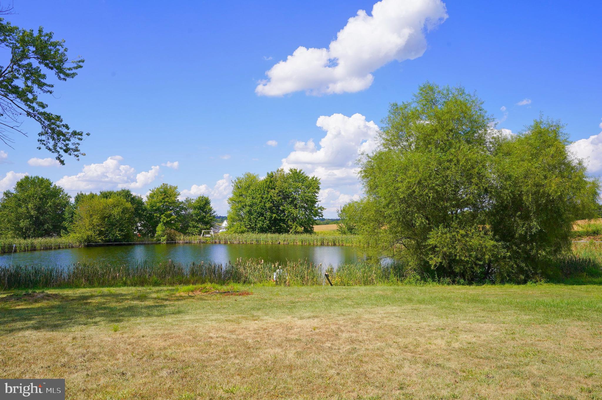 2215 Centennial Road Hanover, PA 17331 - Photo 53 of 60 a view of a lake with a yard
