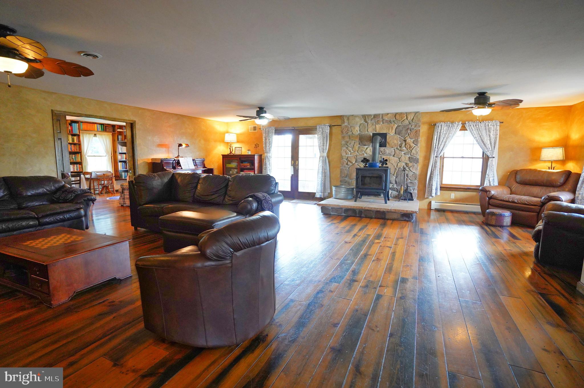 2215 Centennial Road Hanover, PA 17331 - Photo 7 of 60 a living room with furniture and a wooden floor