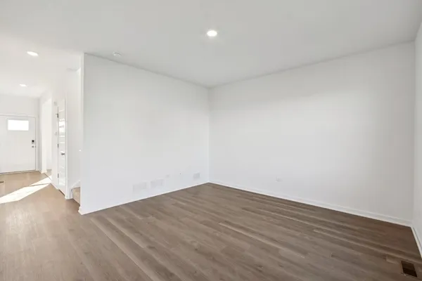 a view of kitchen and wooden floor