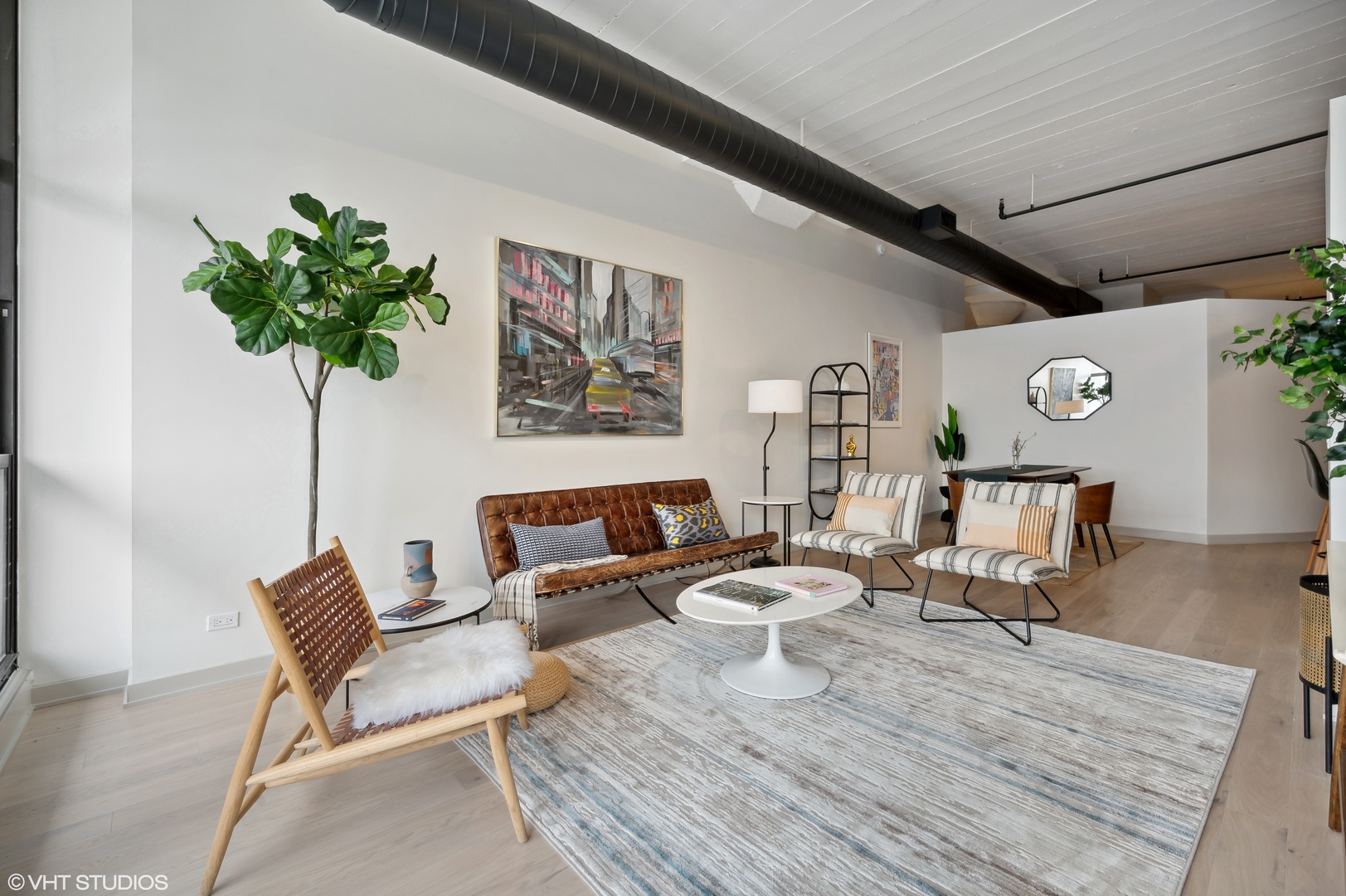 1530 South State Street, Unit 628 Chicago, IL 60605 - Photo 11 of 30 a living room with furniture and a potted plant
