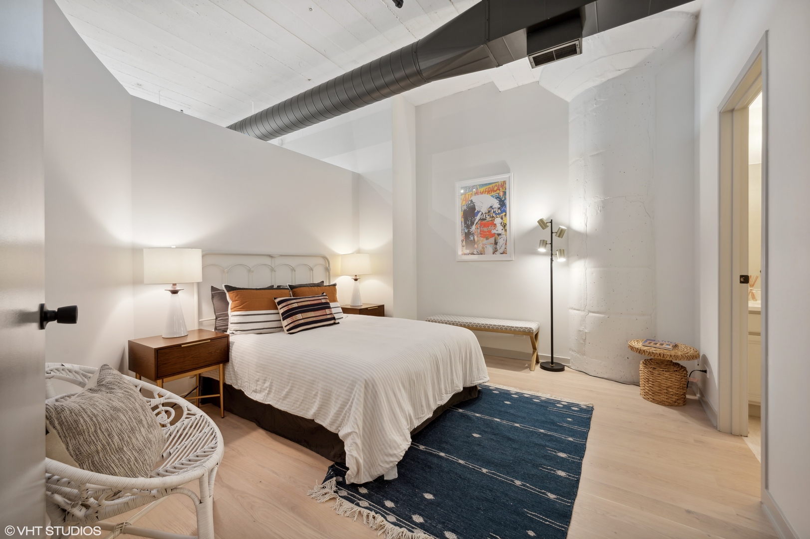 1530 South State Street, Unit 628 Chicago, IL 60605 - Photo 14 of 30 a bedroom with bed and a couch