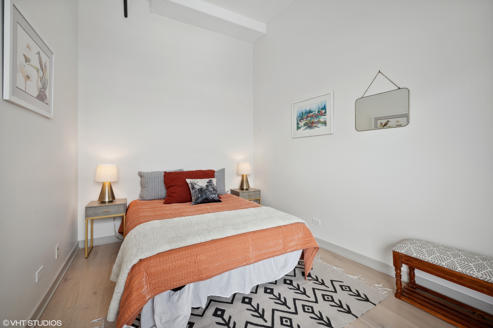 1530 South State Street, Unit 628 Chicago, IL 60605 - Photo 17 of 30 a bedroom with a bed and a lamp with the bookshelf