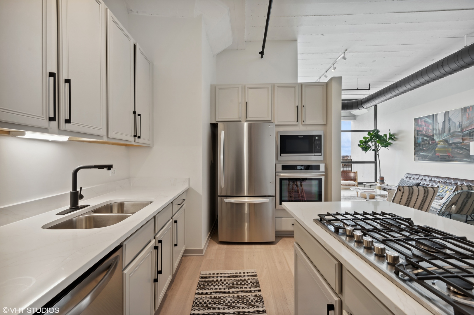 1530 South State Street, Unit 628 Chicago, IL 60605 - Photo 7 of 30 a kitchen with granite countertop a sink stove and refrigerator