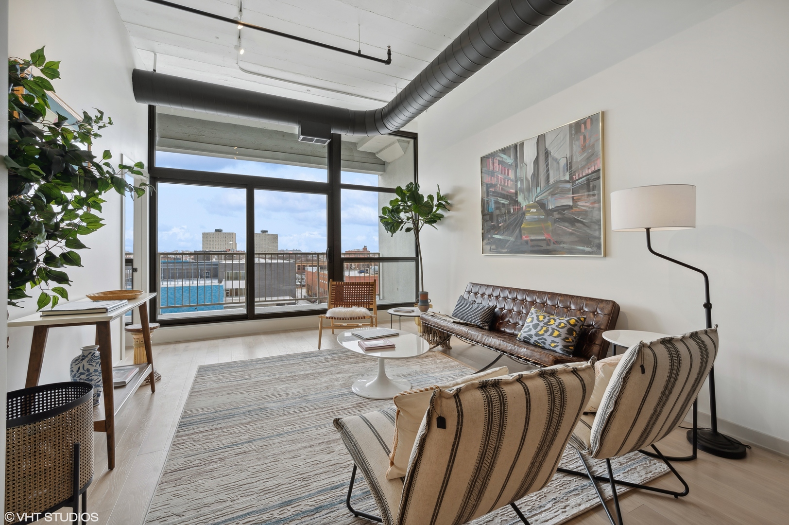 1530 South State Street, Unit 628 Chicago, IL 60605 - Photo 8 of 30 a view of a dining room with furniture large windows and wooden floor