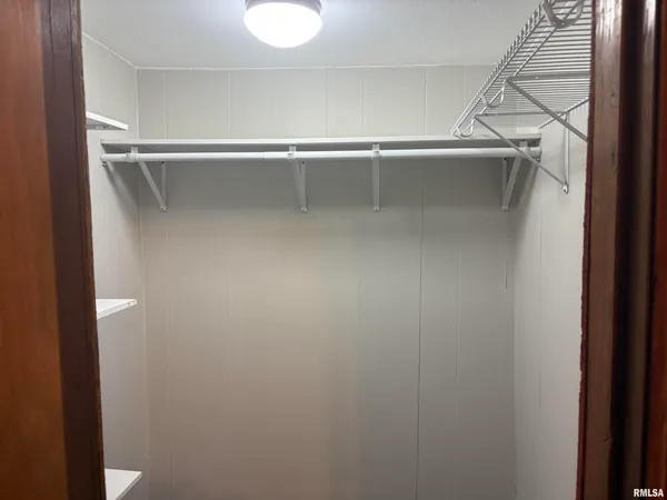 a view of a room with racks on the wall