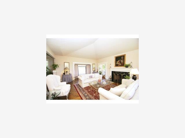 770 Darrell Road Hillsborough, CA 94010 - Photo 2 of 9 a living room with furniture and a fireplace